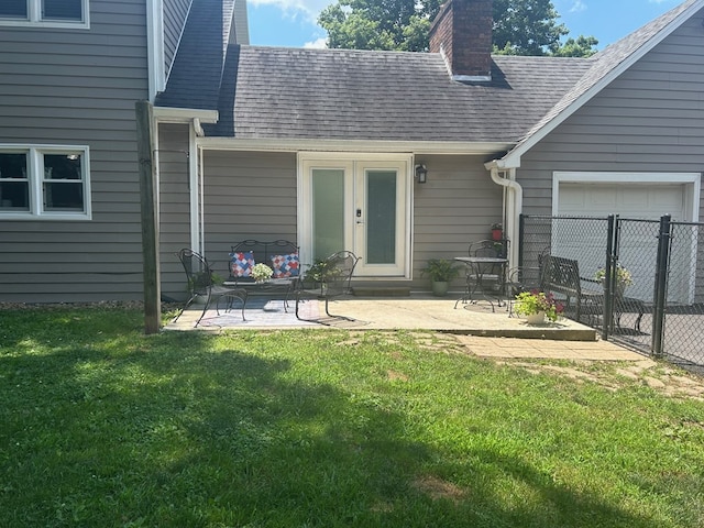 18335 Westwood Dr, Abingdon, VA 24211 - rear view of house featuring a chimney, roof with shingles, a garage, and a patio