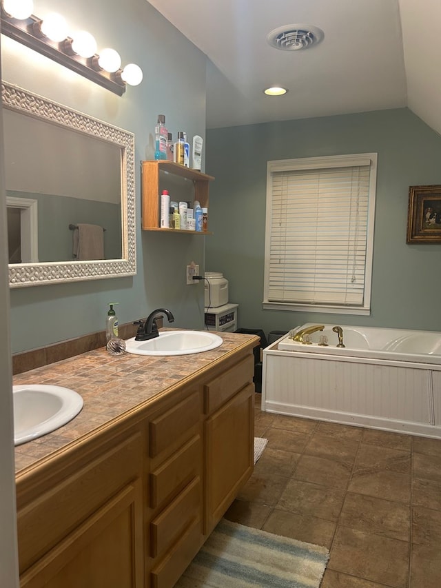 18335 Westwood Dr, Abingdon, VA 24211 - bathroom with double vanity, a bath, and vaulted ceiling