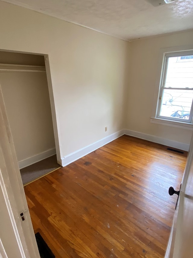 250 Staley St, Marion, VA 24354 - unfurnished bedroom featuring wood-type flooring and baseboards