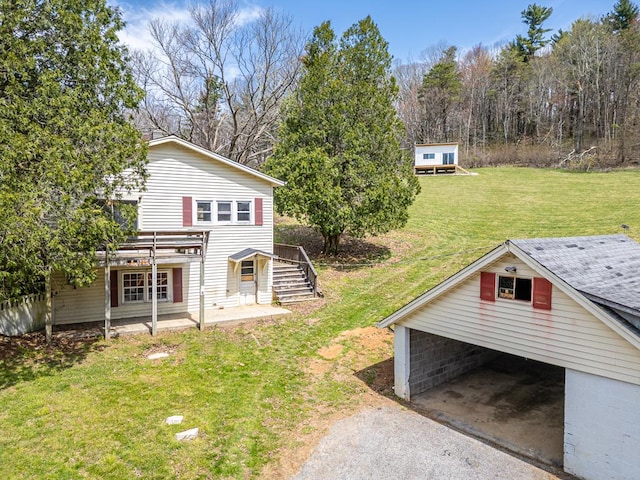 199 Ranger Rd, Fancy Gap, VA 24328 - view of green lawn featuring stairway, an outbuilding, and driveway