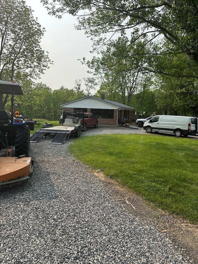 148 Rockspray Dr, Wytheville, VA 24382 - view of front of home featuring driveway, a front yard, and view of scattered trees