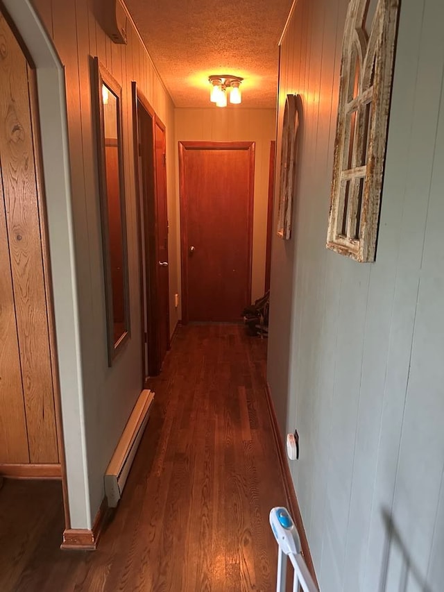 148 Rockspray Dr, Wytheville, VA 24382 - corridor featuring dark wood-style flooring, a textured ceiling, and wood walls