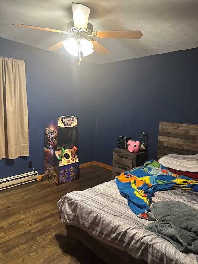 148 Rockspray Dr, Wytheville, VA 24382 - bedroom featuring wood finished floors, a baseboard heating unit, ceiling fan, and a textured ceiling