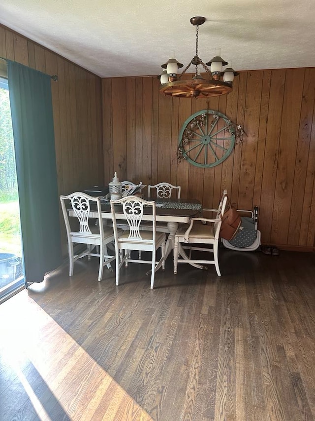 148 Rockspray Dr, Wytheville, VA 24382 - dining room with a chandelier, wood finished floors, and wooden walls