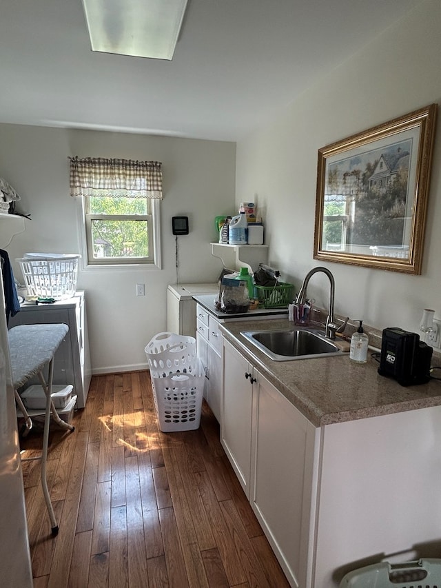 3950 Boyd Rd, Draper, VA 24324 - kitchen with dark wood-style floors, white cabinets, and washer and dryer