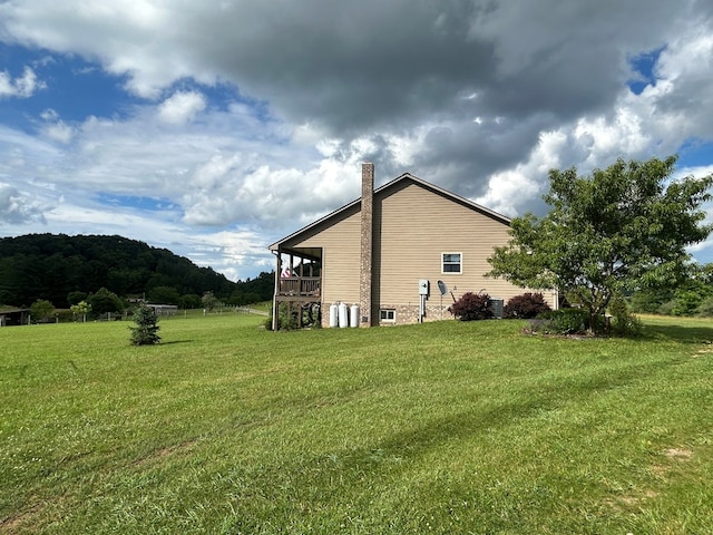 3950 Boyd Rd, Draper, VA 24324 - view of side of home featuring a chimney and a lawn