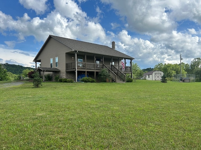 3950 Boyd Rd, Draper, VA 24324 - back of house with a chimney, a yard, a storage unit, and stairway