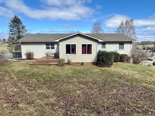 back of house with a yard and a deck
