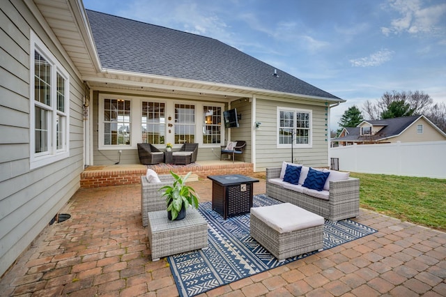 view of patio / terrace with an outdoor hangout area and fence