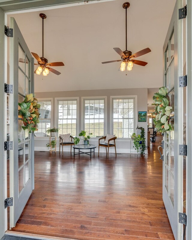 sunroom with french doors, lofted ceiling, and ceiling fan