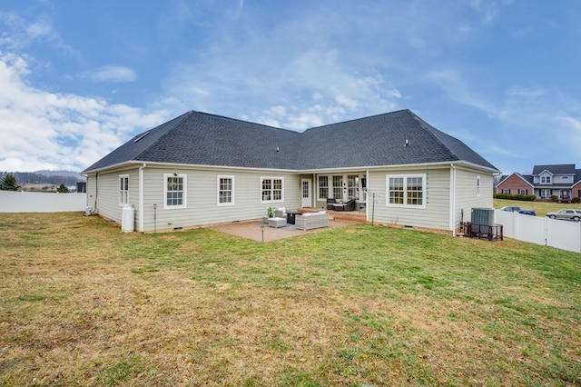 back of property featuring crawl space, a patio, and a lawn