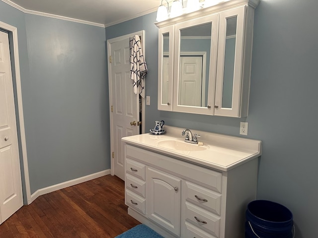 4860 Greasy Creek Rd, Bandy, VA 24602 - bathroom featuring wood finished floors, vanity, ornamental molding, and baseboards