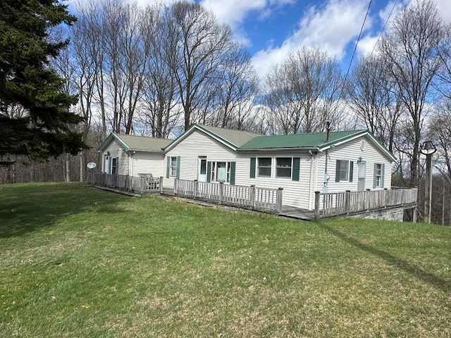 4860 Greasy Creek Rd, Bandy, VA 24602 - view of front facade featuring a deck, metal roof, and a front lawn