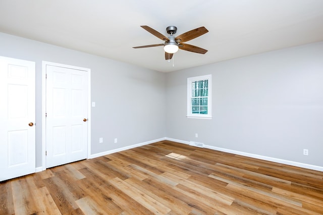 15743 Monticello Dr, Bristol, VA 24202 - spare room with baseboards, ceiling fan, and light wood-style flooring