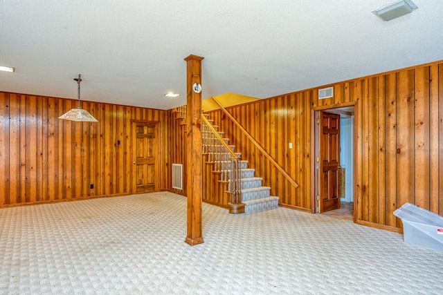 15743 Monticello Dr, Bristol, VA 24202 - finished below grade area with stairway, wood walls, carpet flooring, and a textured ceiling
