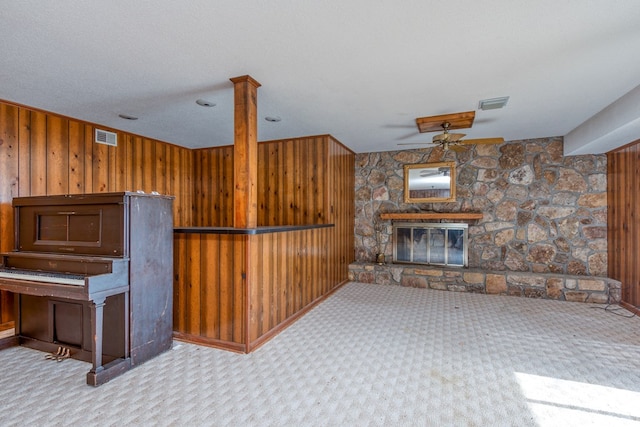15743 Monticello Dr, Bristol, VA 24202 - carpeted living area featuring wood walls and a fireplace