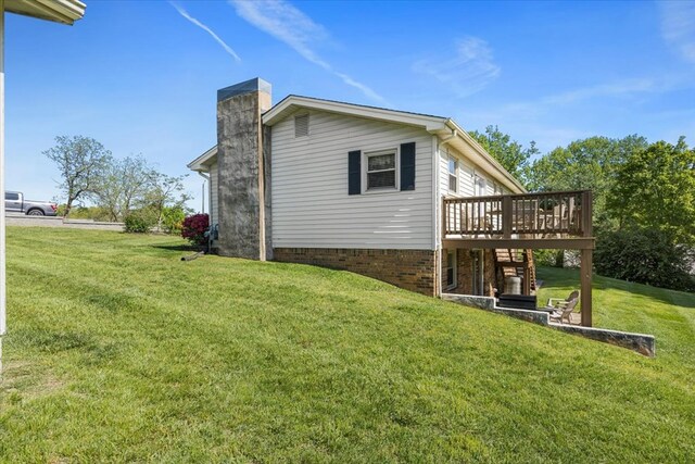 542 Mosswood Ln, Bristol, VA 24201 - view of home's exterior featuring a wooden deck, a chimney, and a yard