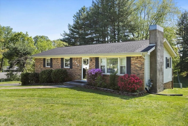 542 Mosswood Ln, Bristol, VA 24201 - ranch-style home featuring brick siding, a front yard, and a chimney