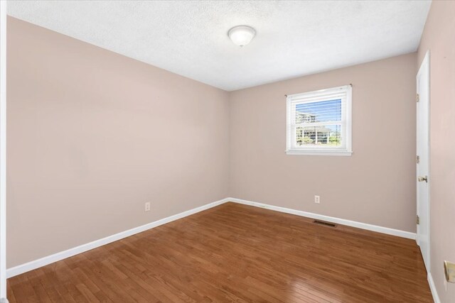 542 Mosswood Ln, Bristol, VA 24201 - spare room featuring baseboards and wood finished floors