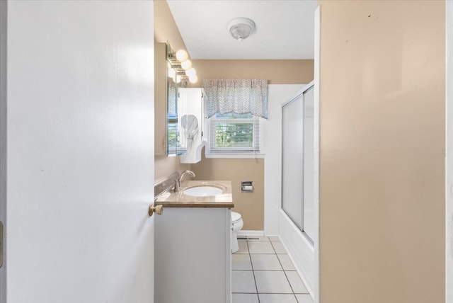 542 Mosswood Ln, Bristol, VA 24201 - bathroom featuring toilet, tile patterned floors, vanity, bath / shower combo with glass door, and baseboards