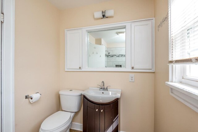 bathroom featuring toilet and vanity