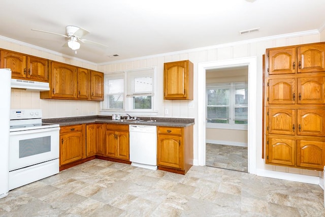kitchen with crown molding, brown cabinetry, white appliances, under cabinet range hood, and visible vents