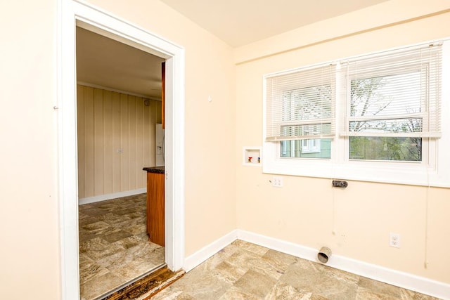 laundry area with electric dryer hookup, baseboards, hookup for a washing machine, and a healthy amount of sunlight