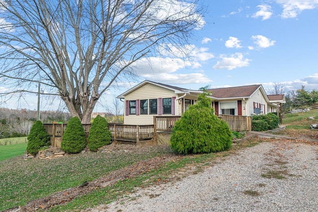 view of front of house featuring a wooden deck