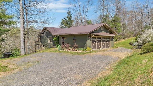 101 Spring Haven Dr, Fancy Gap, VA 24328 - view of side of home with driveway, a garage, and metal roof