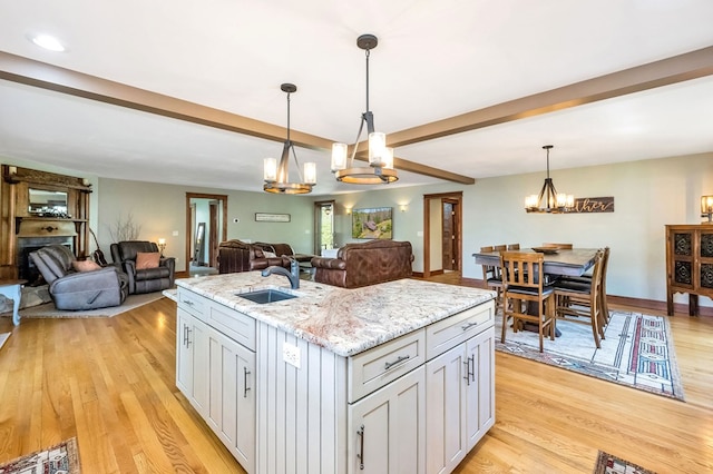 101 Spring Haven Dr, Fancy Gap, VA 24328 - kitchen featuring a sink, a chandelier, light wood-type flooring, beamed ceiling, and recessed lighting