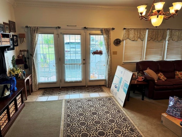 doorway with light colored carpet, light tile patterned floors, a notable chandelier, and crown molding