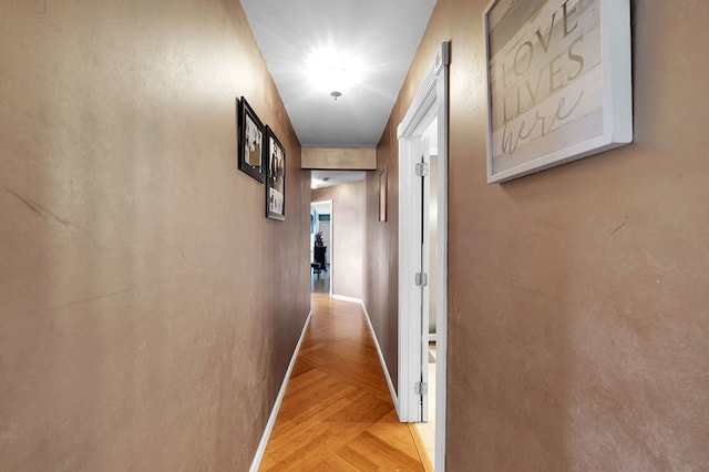 corridor with light parquet flooring