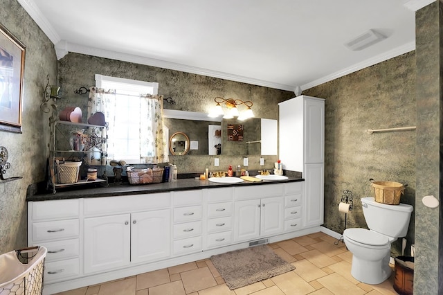 bathroom with ornamental molding, toilet, tile patterned flooring, and vanity