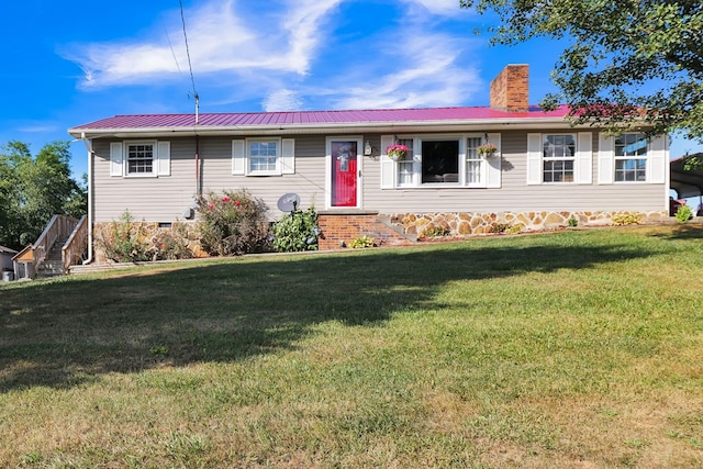 ranch-style home with a front yard