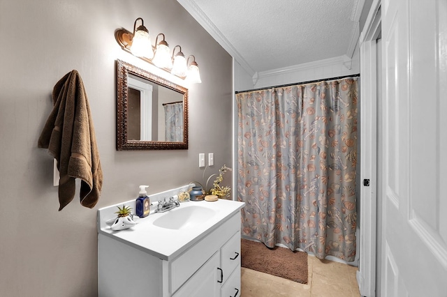 bathroom featuring tile patterned floors, ornamental molding, a textured ceiling, and vanity