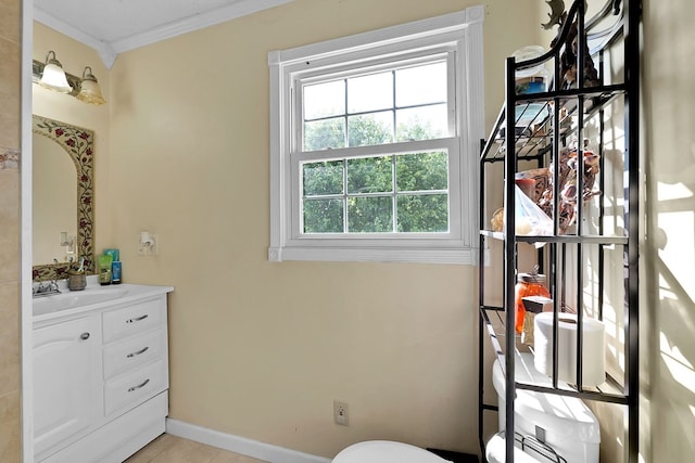 bathroom featuring vanity, tile patterned floors, and ornamental molding