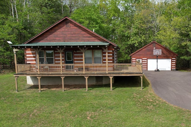 805 Double Bridges Dr, Fancy Gap, VA 24328 - log-style house featuring an outbuilding, a detached garage, a front yard, and a deck