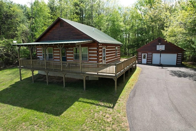 805 Double Bridges Dr, Fancy Gap, VA 24328 - log-style house with an outbuilding, a garage, a front yard, log exterior, and a deck