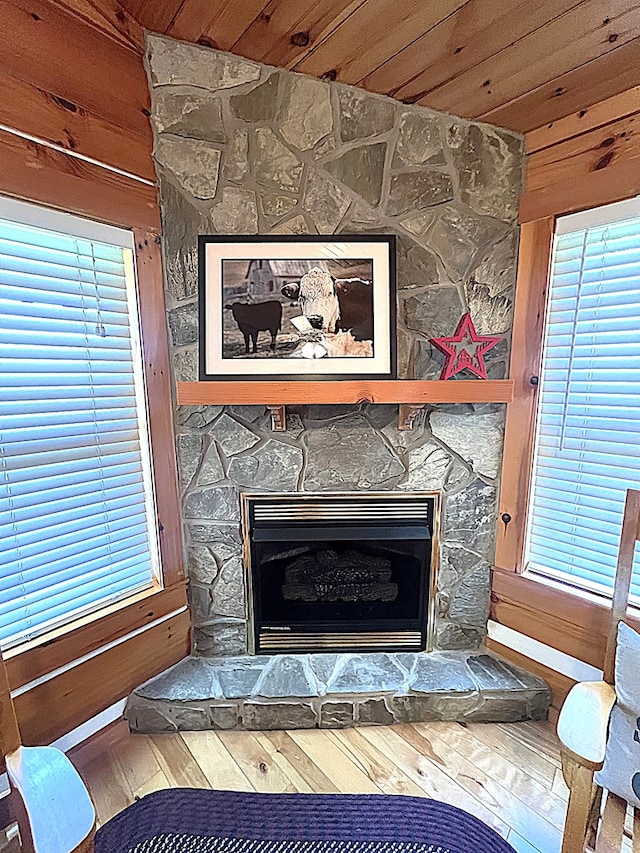 805 Double Bridges Dr, Fancy Gap, VA 24328 - detailed view of a stone fireplace, wood ceiling, wood finished floors, and wooden walls