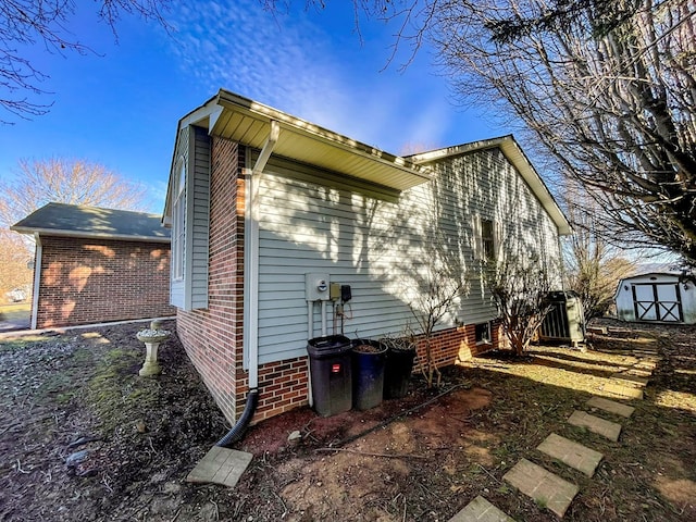 rear view of property with a shed