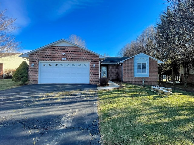 ranch-style home with a garage and a front yard