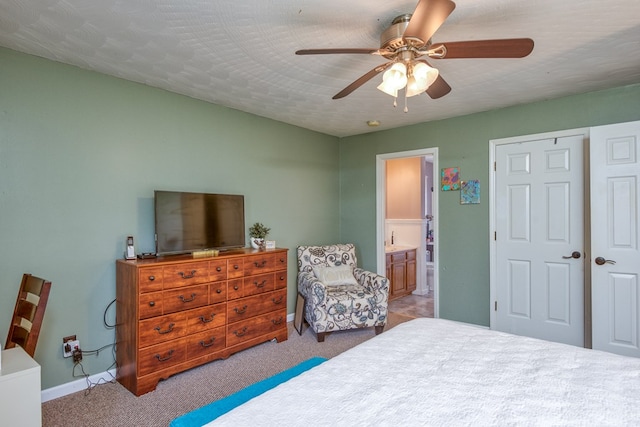 556 Stoney Battery Rd, Marion, VA 24354 - carpeted bedroom with baseboards, ensuite bath, and a ceiling fan