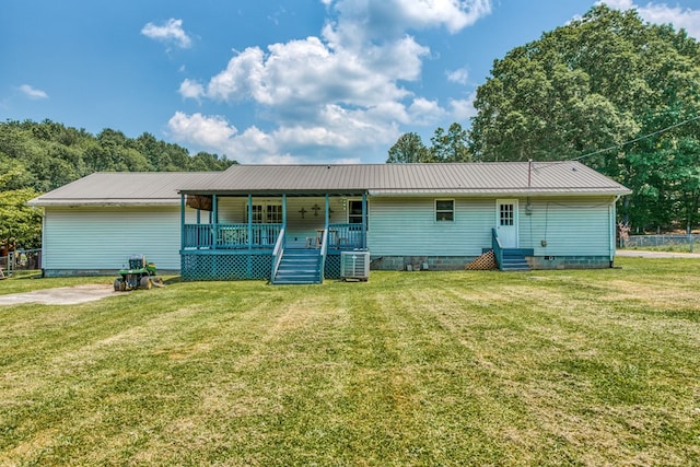 556 Stoney Battery Rd, Marion, VA 24354 - rear view of house featuring crawl space, cooling unit, covered porch, and a lawn