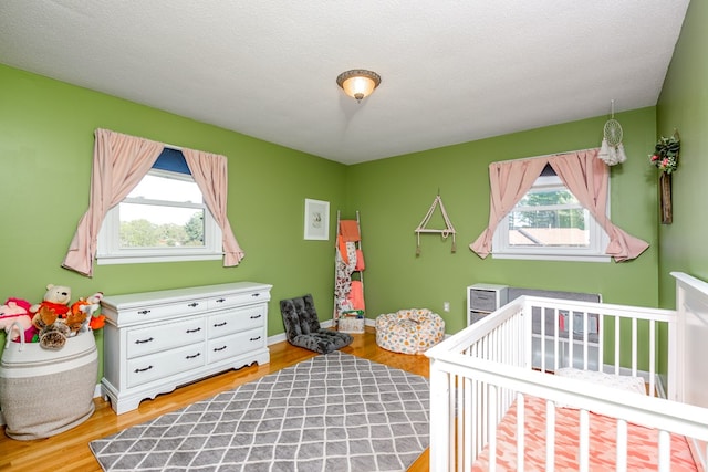 515 Meadowcrest Dr, Bristol, VA 24201 - bedroom with light wood-style floors and a nursery area