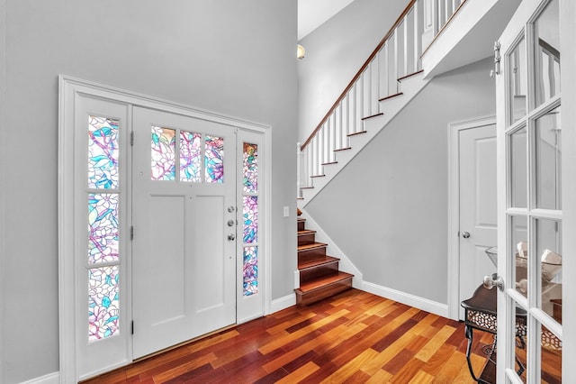 567 Saint James Rd, Chilhowie, VA 24319 - foyer featuring stairway, wood finished floors, baseboards, and a towering ceiling