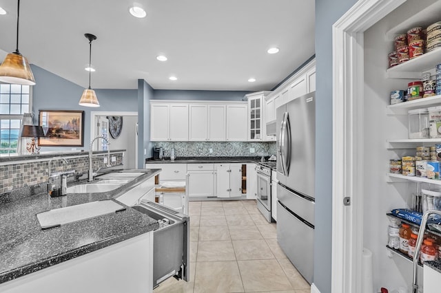567 Saint James Rd, Chilhowie, VA 24319 - kitchen with a sink, stainless steel appliances, backsplash, white cabinetry, and recessed lighting