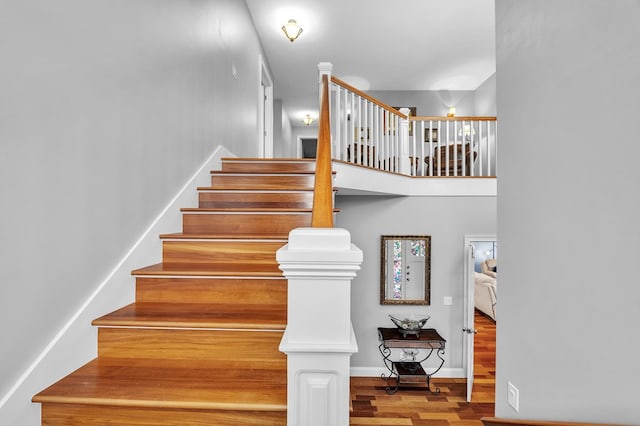 567 Saint James Rd, Chilhowie, VA 24319 - stairs featuring wood finished floors, a towering ceiling, and baseboards