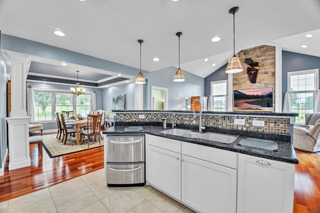 567 Saint James Rd, Chilhowie, VA 24319 - kitchen featuring open floor plan, a sink, ornate columns, white cabinets, and vaulted ceiling