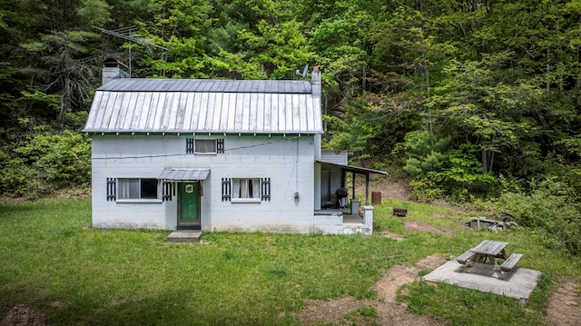 TBD Blue Springs Rd, Elk Creek, VA 24326 - back of house with a yard, a chimney, concrete block siding, and a view of trees