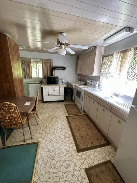 TBD Blue Springs Rd, Elk Creek, VA 24326 - kitchen featuring black microwave, white range oven, light floors, light countertops, and a ceiling fan
